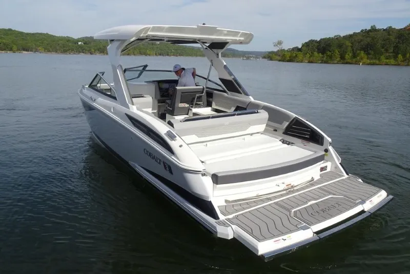 Slide: The Image of 2026 Cobalt A29 boat on a serene lake, showcasing sleek design and spacious deck. - 6