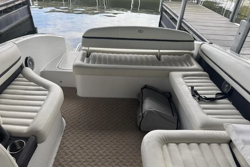 Slide: The Image of 2015 Cobalt R7 boat interior with white leather seating and cup holders. - 11