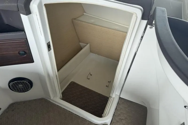 Slide: The Image of 2015 Cobalt R7 boat interior with white leather seating and cup holders. - 13