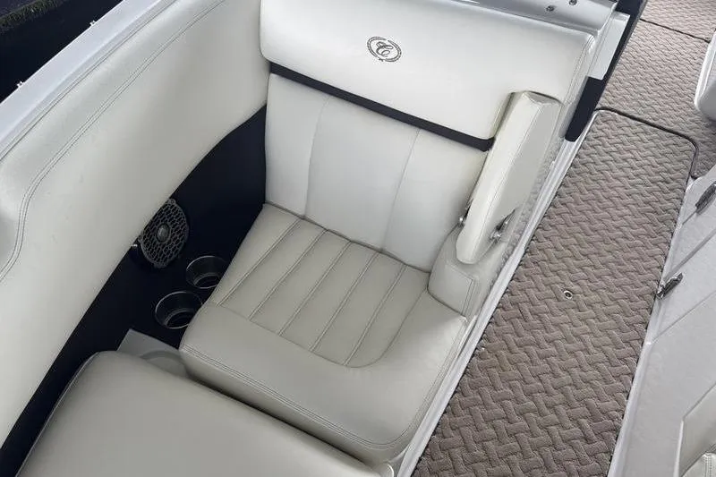 Slide: The Image of Interior of a 2015 Cobalt R7 boat showing steering wheel and dashboard controls. - 14