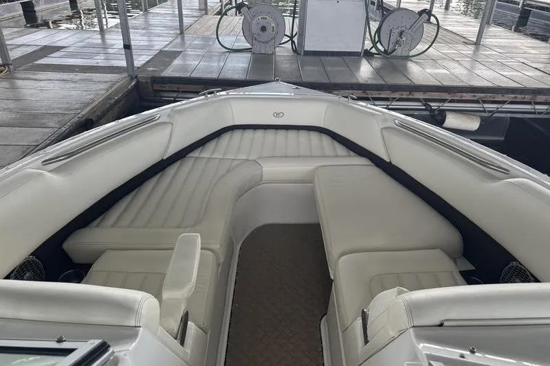 Slide: The Image of Luxurious white seating in a 2015 Cobalt R7 boat interior. - 16