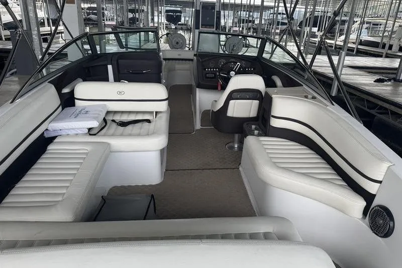 Slide: The Image of 2015 Cobalt R7 boat interior with white seating and steering console. - 3
