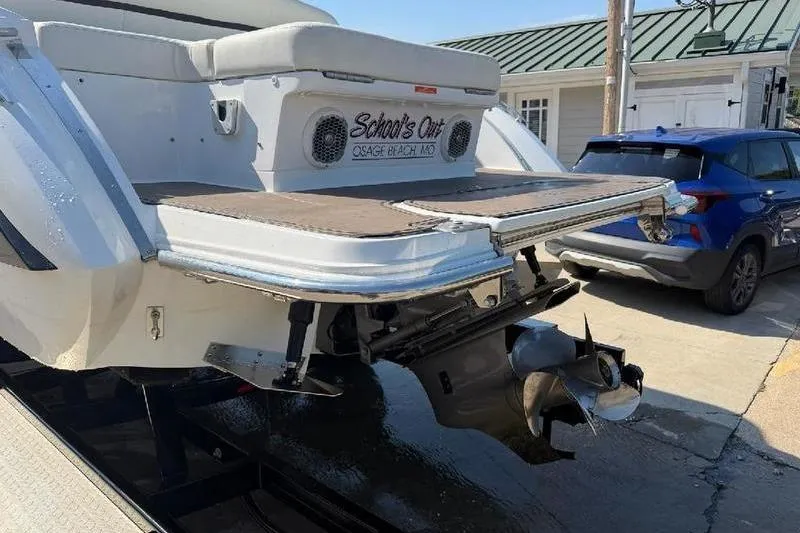 Slide: The Image of 2015 Cobalt R7 boat docked in a marina, featuring sleek design and spacious seating. - 5