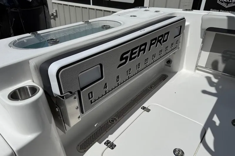 Slide: The Image of 2026 Sea Pro 222 Center Console boat interior with measuring scale and cup holder. - 16