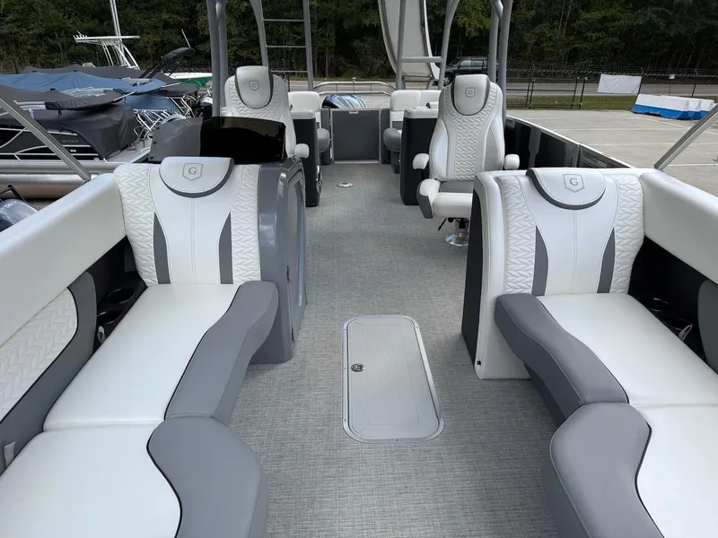 Slide: The Image of 2023 Godfrey Monaco 255 SD boat interior with luxurious seating and modern design. - 10