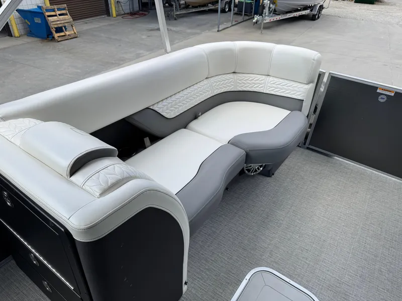 Slide: The Image of Luxurious seating on 2023 Godfrey Monaco 255 SD pontoon boat, featuring elegant upholstery. - 12