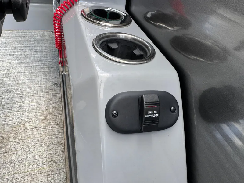 Slide: The Image of 2023 Godfrey Monaco 255 SD boat console with cup holders and safety switch. - 17