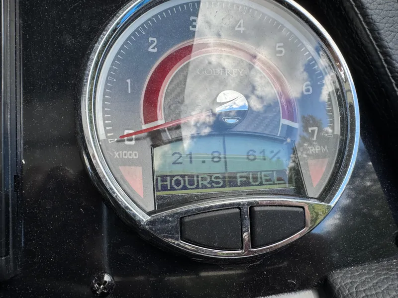Slide: The Image of Close-up of 2023 Godfrey Monaco 255 SD dashboard gauge displaying RPM and fuel hours. - 18