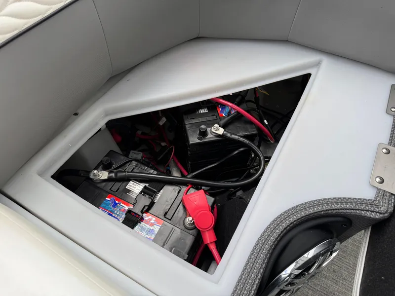 Slide: The Image of Battery compartment of 2023 Godfrey Monaco 255 SD boat with wiring and connections. - 19