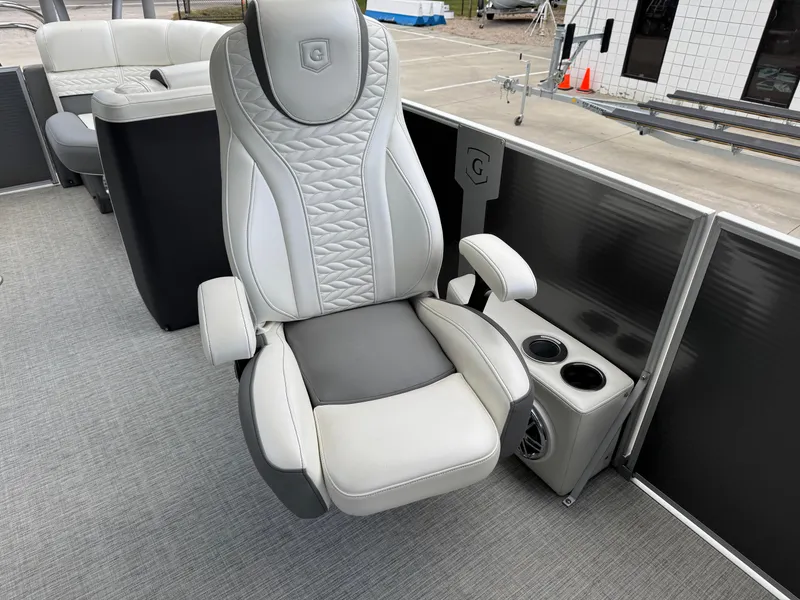 Slide: The Image of Luxurious seating on 2023 Godfrey Monaco 255 SD pontoon boat with cup holders. - 21
