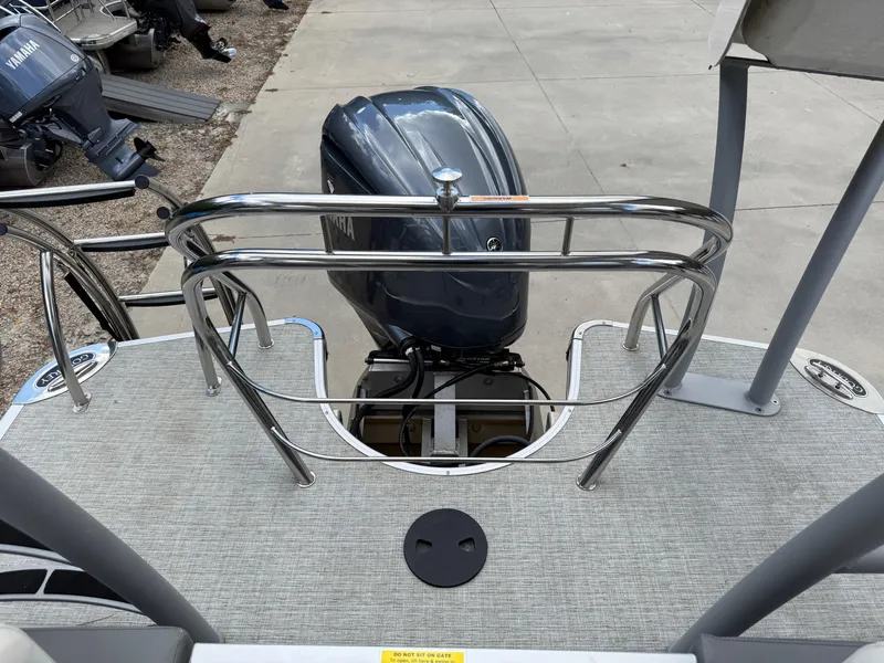 Slide: The Image of 2023 Godfrey Monaco 255 SD boat with outboard motor and stainless steel railing. - 23