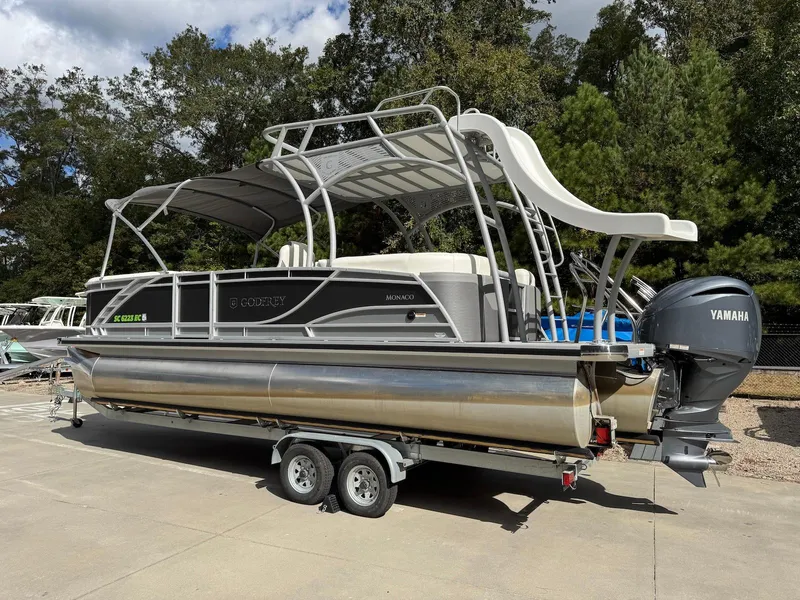 Slide: The Image of 2023 Godfrey Monaco 255 SD pontoon boat with Yamaha engine on a trailer. - 3