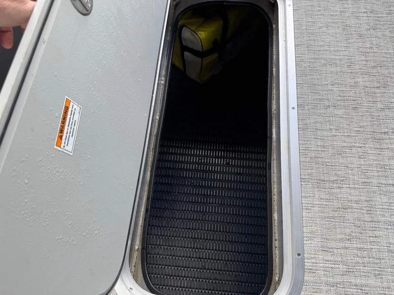 Slide: The Image of Open storage compartment on 2023 Godfrey Monaco 255 SD boat. - 30