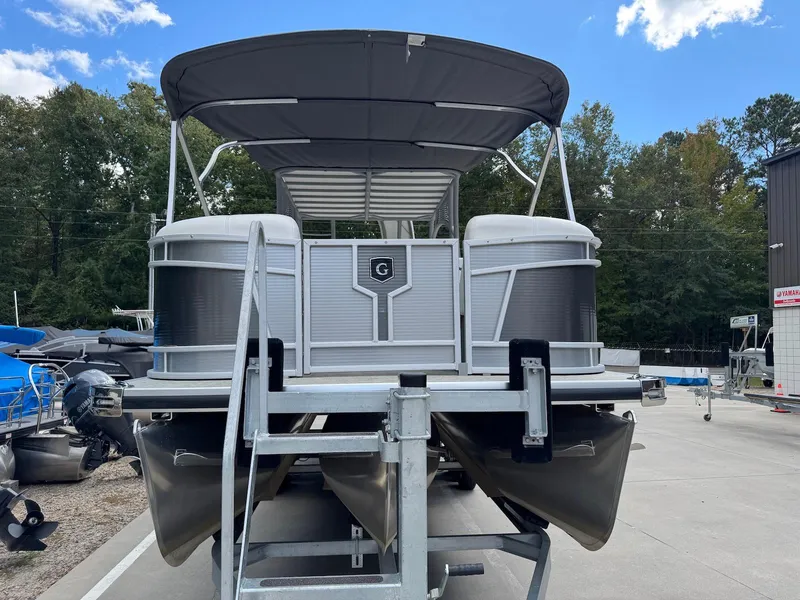 Slide: The Image of 2023 Godfrey Monaco 255 SD pontoon boat on trailer, outdoor dealership setting. - 8