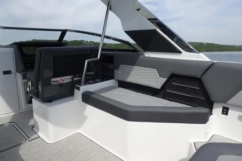 Slide: The Image of 2026 Cobalt A29 boat interior with sleek seating and modern design on a calm lake. - 13