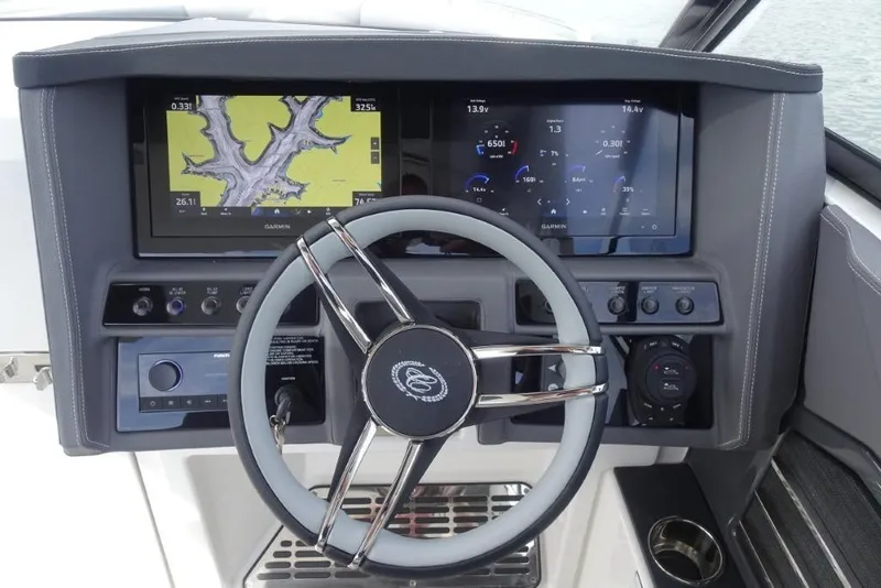 Slide: The Image of 2026 Cobalt A29 boat dashboard with steering wheel and dual Garmin displays. - 17