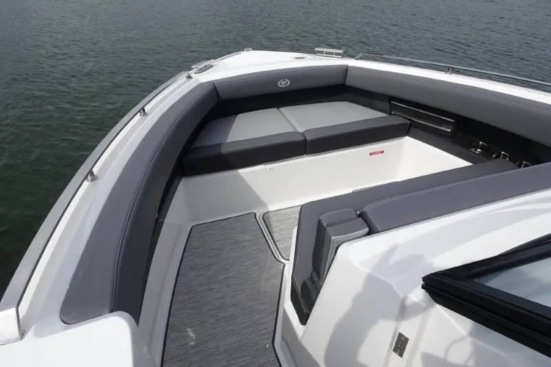 Slide: The Image of 2026 Cobalt A29 boat interior with sleek seating and modern design on calm water. - 24