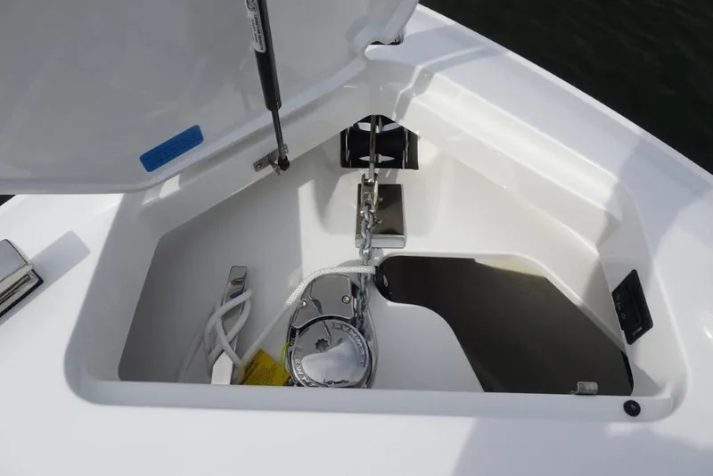 Slide: The Image of 2026 Cobalt A29 boat anchor compartment with chain and winch system. - 26