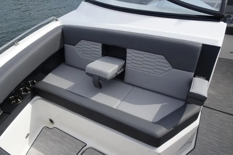Slide: The Image of 2026 Cobalt A29 boat interior with gray seating and cup holders. - 27