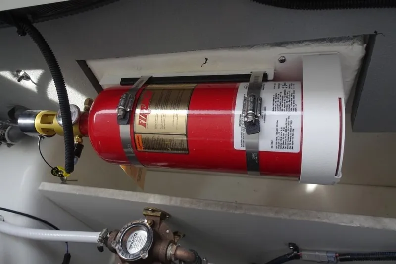 Slide: The Image of Fire extinguisher installed in 2026 Cobalt A29 boat engine compartment. - 31