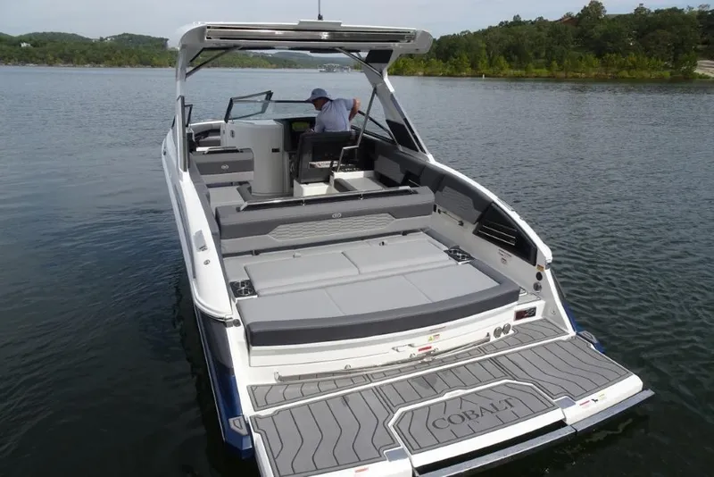 Slide: The Image of 2026 Cobalt A29 boat on calm lake, featuring spacious seating and sleek design. - 8