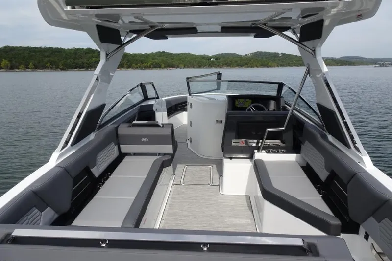 Slide: The Image of 2026 Cobalt A29 boat interior with sleek seating and modern design on a calm lake. - 9