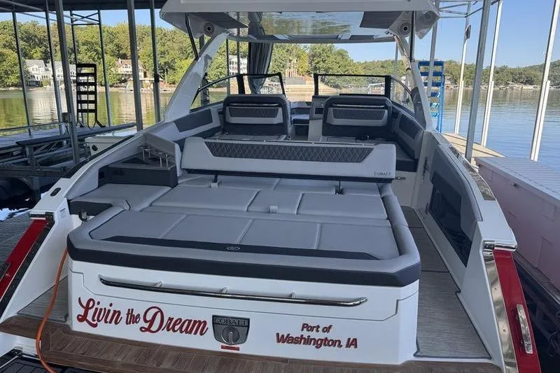 Slide: The Image of 2024 Cobalt R35 boat docked, featuring spacious seating and "Livin' the Dream" text. - 10