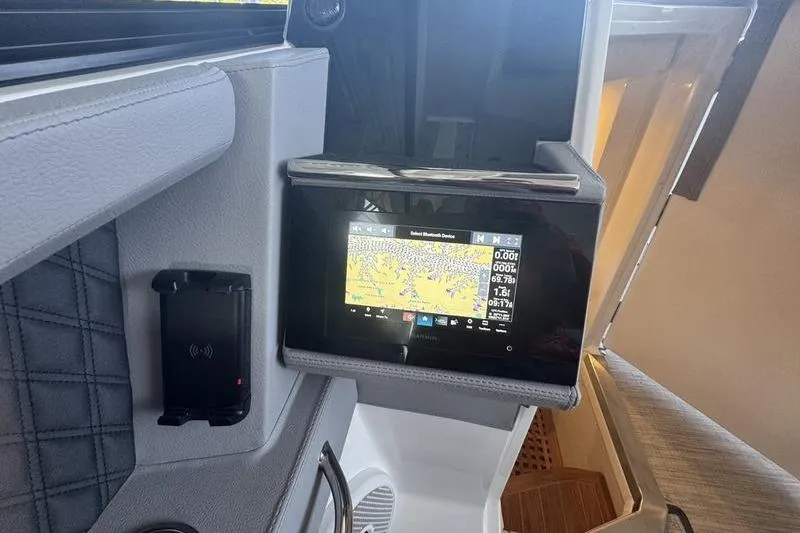 Slide: The Image of 2024 Cobalt R35 boat interior with navigation display and control panel. - 13