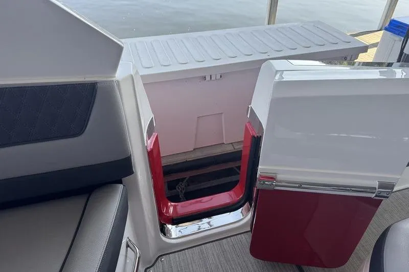 Slide: The Image of 2024 Cobalt R35 boat interior with open storage compartment and seating. - 7
