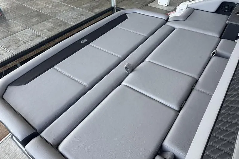 Slide: The Image of 2024 Cobalt R35 boat interior with sleek gray seating and modern design. - 9