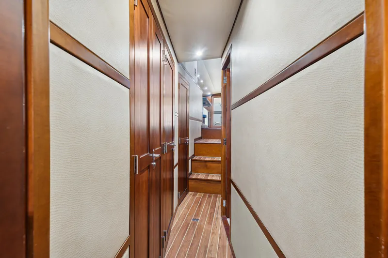 Slide: The Image of Interior hallway of 2012 Bertram Custom Sportfish yacht with wooden finishes. - 11