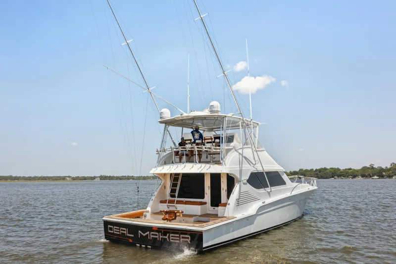 Slide: The Image of 2012 Bertram Custom Sportfish yacht on water, rear view, clear sky. - 3