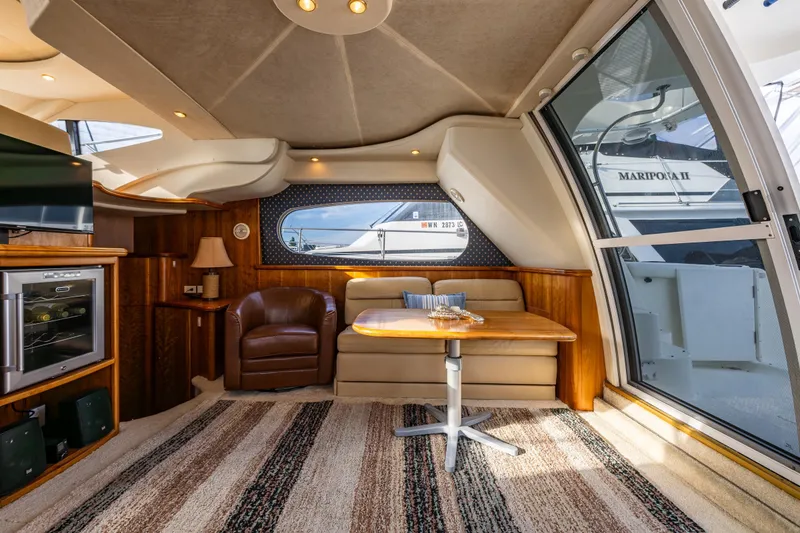 Slide: The Image of Luxurious interior of 2001 Silverton 410 Sport Bridge yacht with cozy seating and elegant decor. - 20