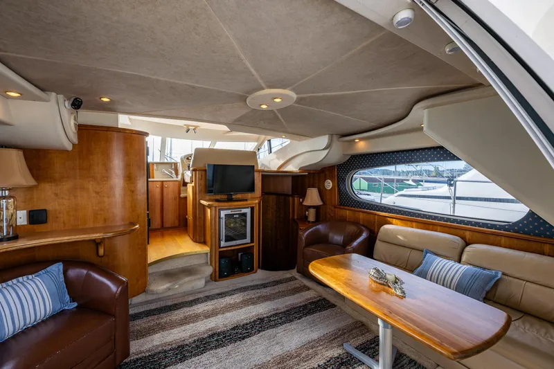 Slide: The Image of Luxurious interior of 2001 Silverton 410 Sport Bridge yacht with cozy seating and elegant decor. - 22