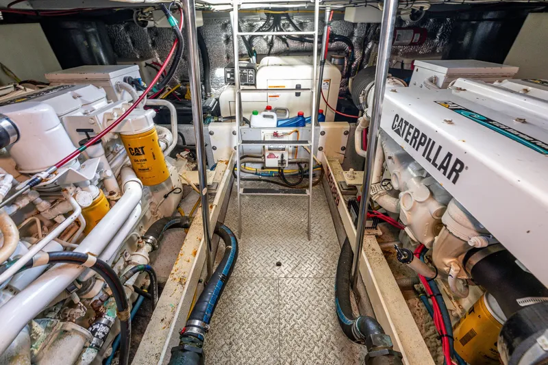 Slide: The Image of Engine room of 2001 Silverton 410 Sport Bridge with Caterpillar engines and equipment. - 31