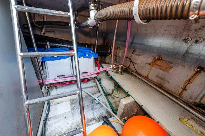Slide: The Image of Engine room of 2001 Silverton 410 Sport Bridge with batteries and wiring. - 34