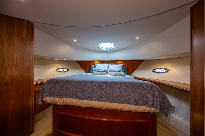 Slide: The Image of Luxurious cabin interior of 2001 Silverton 410 Sport Bridge yacht with cozy bedding. - 7
