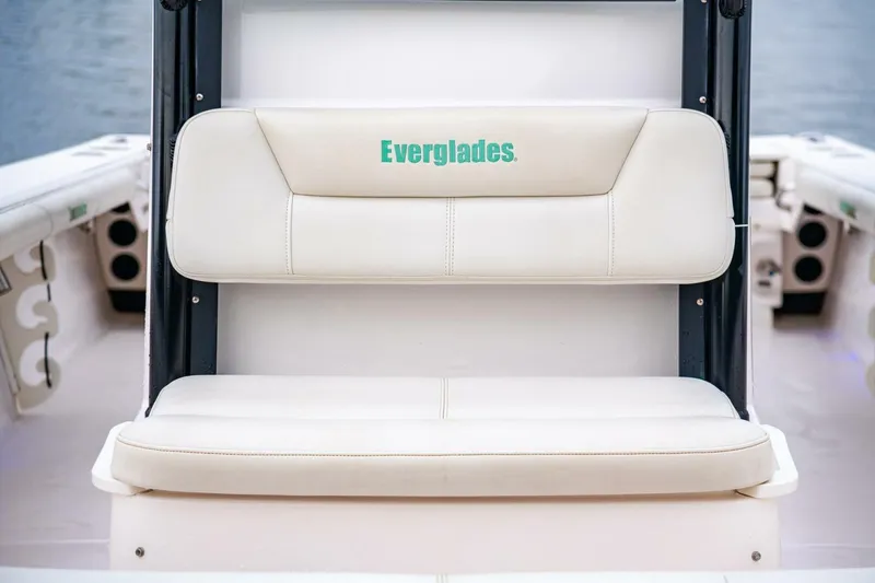 Slide: The Image of 2018 Everglades 243 Center Console boat seat with logo, featuring white upholstery. - 17