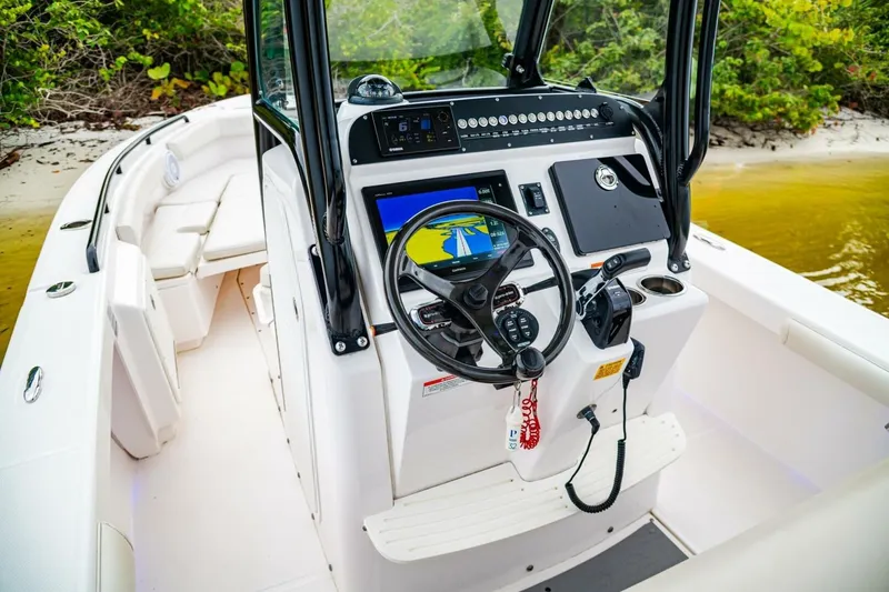 Slide: The Image of 2018 Everglades 243 Center Console boat interior with advanced navigation system. - 21