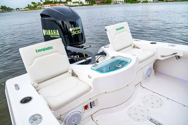 Slide: The Image of 2018 Everglades 243 Center Console boat with Yamaha 300 engine on calm water. - 28