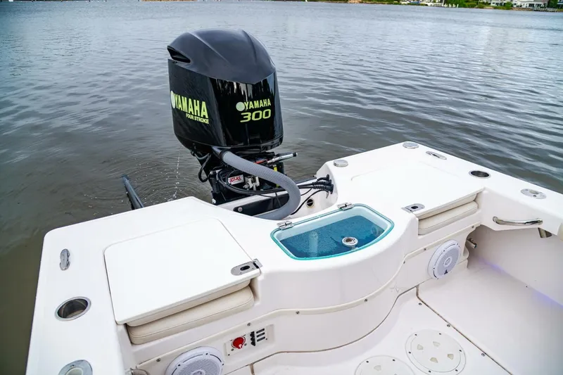 Slide: The Image of 2018 Everglades 243 Center Console boat with Yamaha 300 engine on calm water. - 29