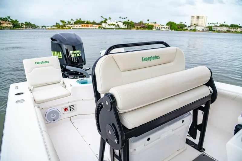 Slide: The Image of 2018 Everglades 243 Center Console boat interior with Yamaha 300 engine on a calm waterway. - 34