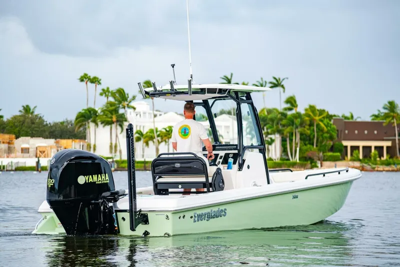 Slide: The Image of 2018 Everglades 243 Center Console boat on water, featuring Yamaha engine. - 4
