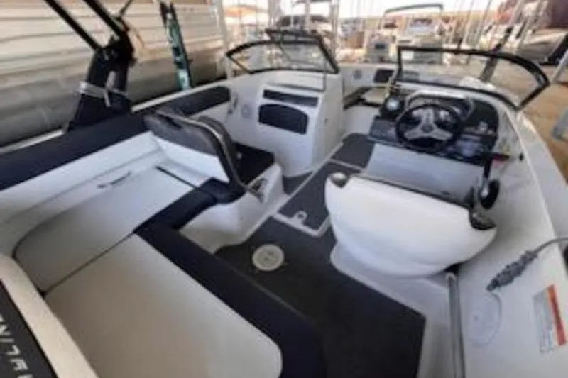 Slide: The Image of 2021 Bayliner VR5 Cuddy boat interior with seating and wet deck. - 11