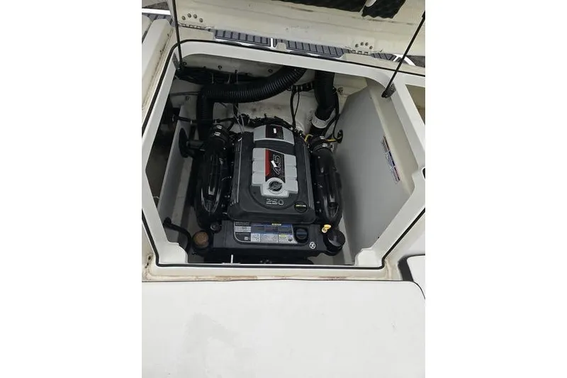 Slide: The Image of Engine compartment of a 2021 Bayliner VR5 Cuddy boat, showcasing the motor. - 15