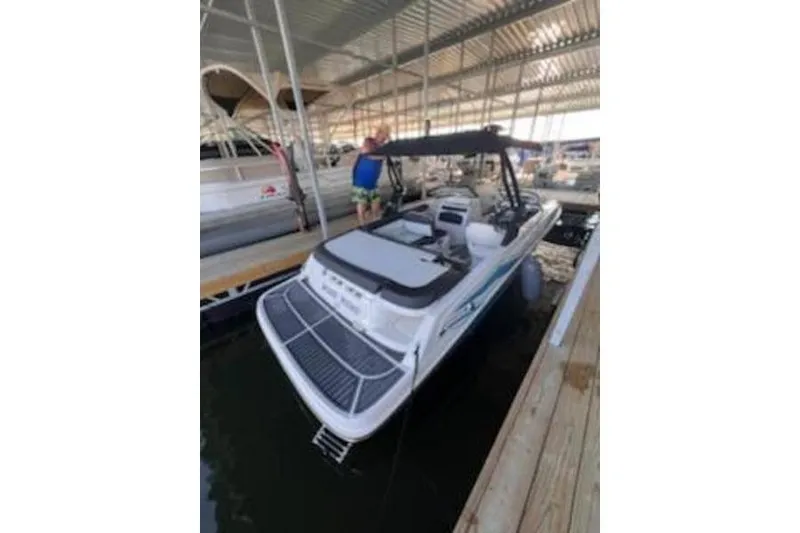 Slide: The Image of 2021 Bayliner VR5 Cuddy boat on trailer in front of a building. - 7
