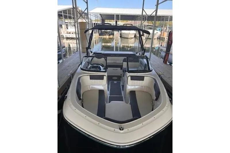 Slide: The Image of 2021 Bayliner VR5 Cuddy cockpit with steering wheel and cushioned seat. - 8