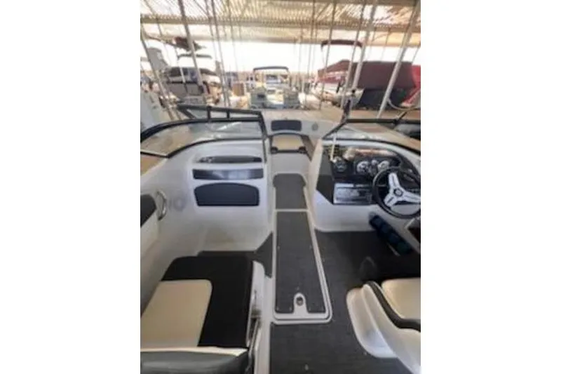 Slide: The Image of 2021 Bayliner VR5 Cuddy boat on trailer, parked outdoors on wet pavement. - 9