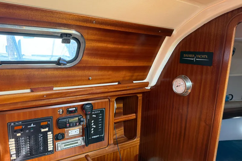 Slide: The Image of Interior of 2002 Bavaria 37 Sloop yacht with control panel and wood finish. - 23