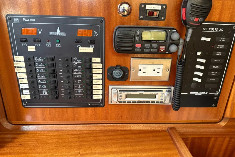 Slide: The Image of Control panel of a 2002 Bavaria 37 Sloop with various switches and devices. - 6